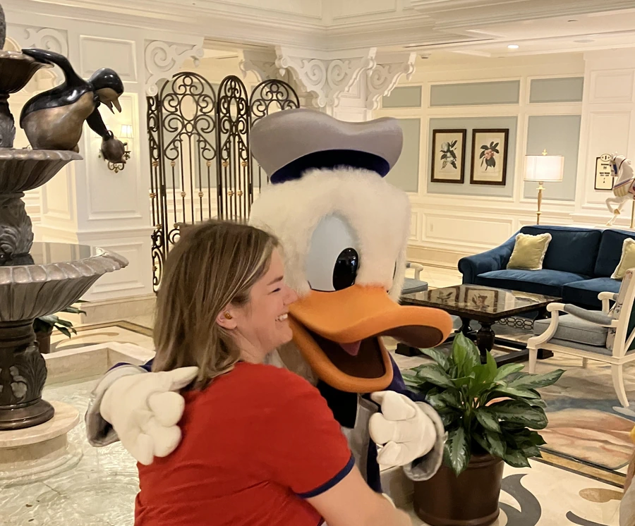 wearomg Hearing aid at disney, meeting disney donald duck