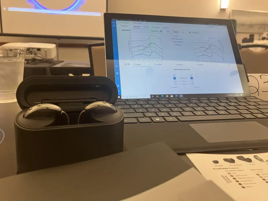 Starkey Genesis hearing aids next to programing starkey pro fit software